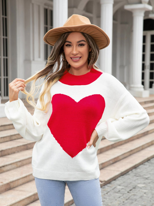 Deep red angel wings and heart graphic sweater by Trendsi, showcasing cozy knit fabric and stylish design.