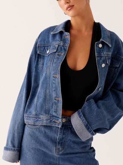 Dark blue oversized denim jacket with button-down front and cropped fit from Trendsi, casual and stylish for everyday wear.