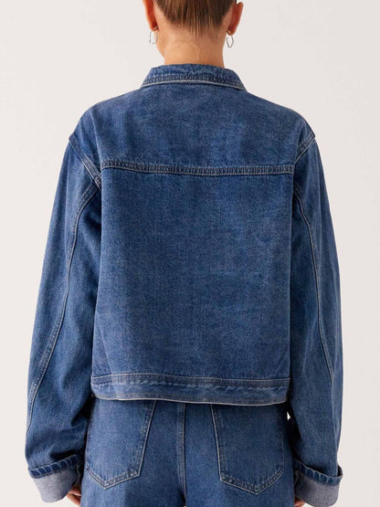 Dark blue oversized denim jacket with button-down front, cropped style, from Trendsi, featuring a classic denim look.