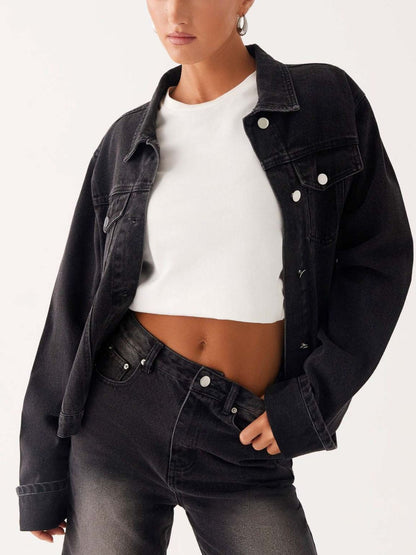 Dark blue oversized denim jacket with button-down front, cropped fit, from Trendsi, featuring classic denim styling.