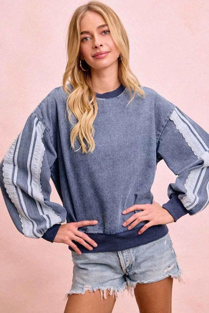 BiBi washed denim sweatshirt by Trendsi featuring lace contrast sides and a casual, stylish fit.