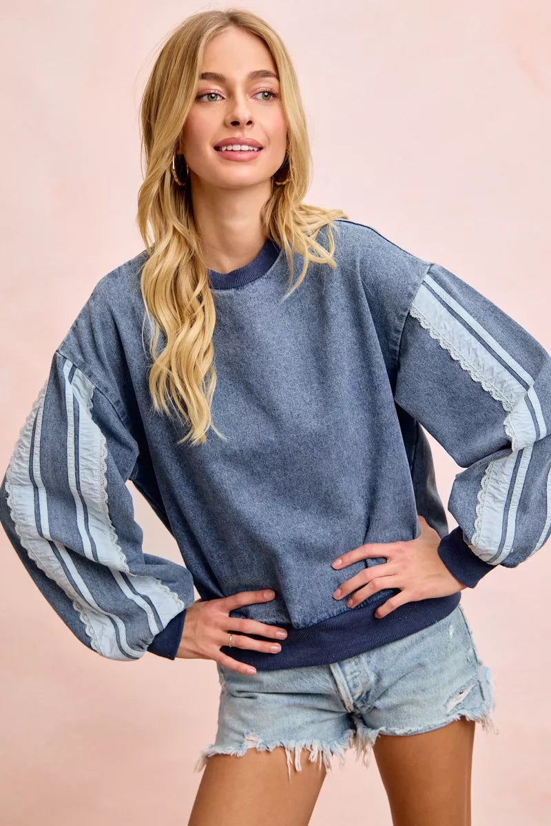 Trendsi BiBi washed denim sweatshirt with lace contrast sides, casual long-sleeve top featuring a relaxed fit and stylish details.