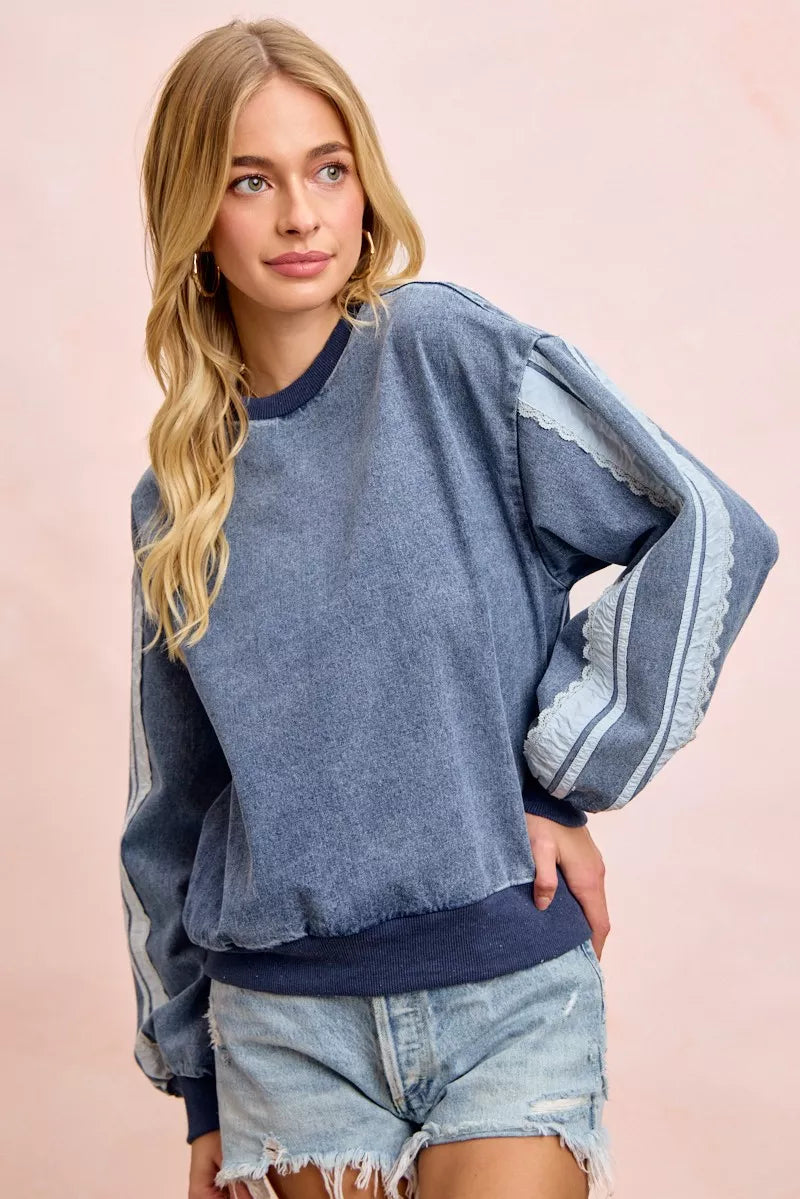 Trendsi BiBi washed denim sweatshirt with lace contrast sides, featuring a casual fit and stylish denim and lace details.
