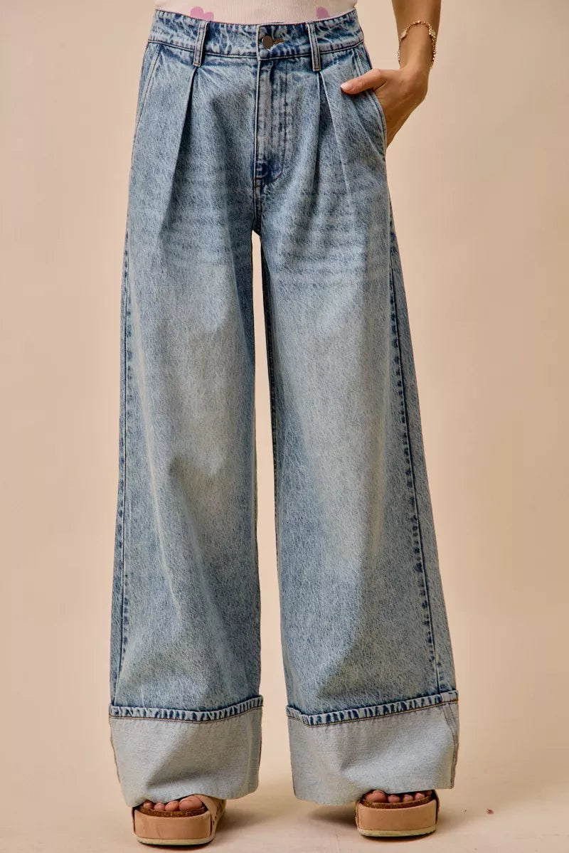 Light blue SO ME mid-rise plated wide-leg denim jeans with front pockets and a relaxed fit, styled on a model.