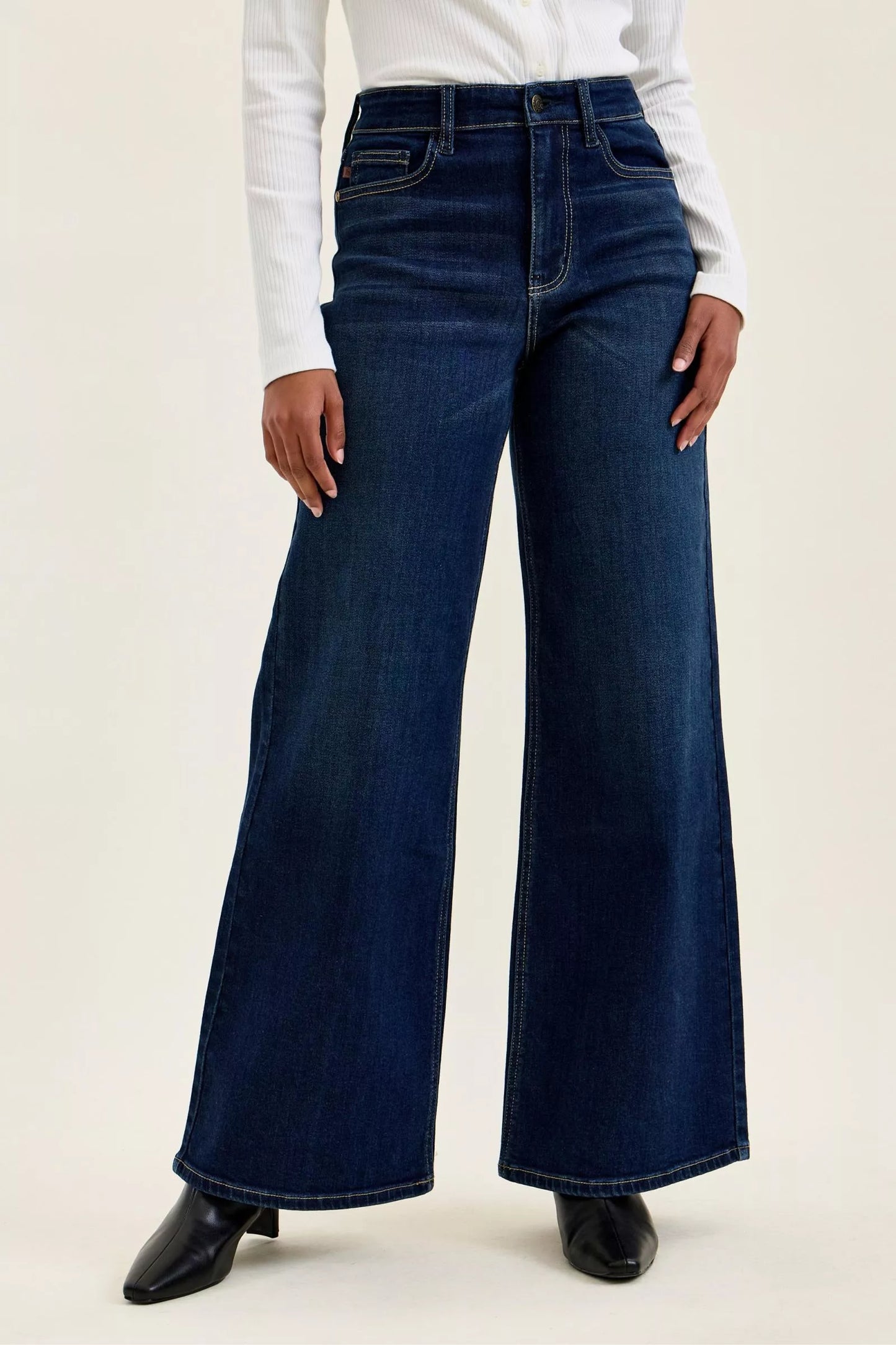 Dark wash Judy Blue high-waisted wide-leg jeans with classic denim texture, styled with a casual, relaxed fit.