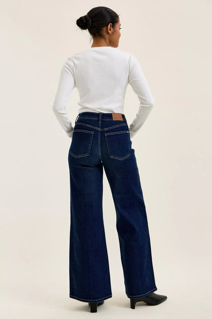Dark wash Judy Blue high-waisted wide-leg jeans with classic fit and stylish design, displayed on a neutral background.