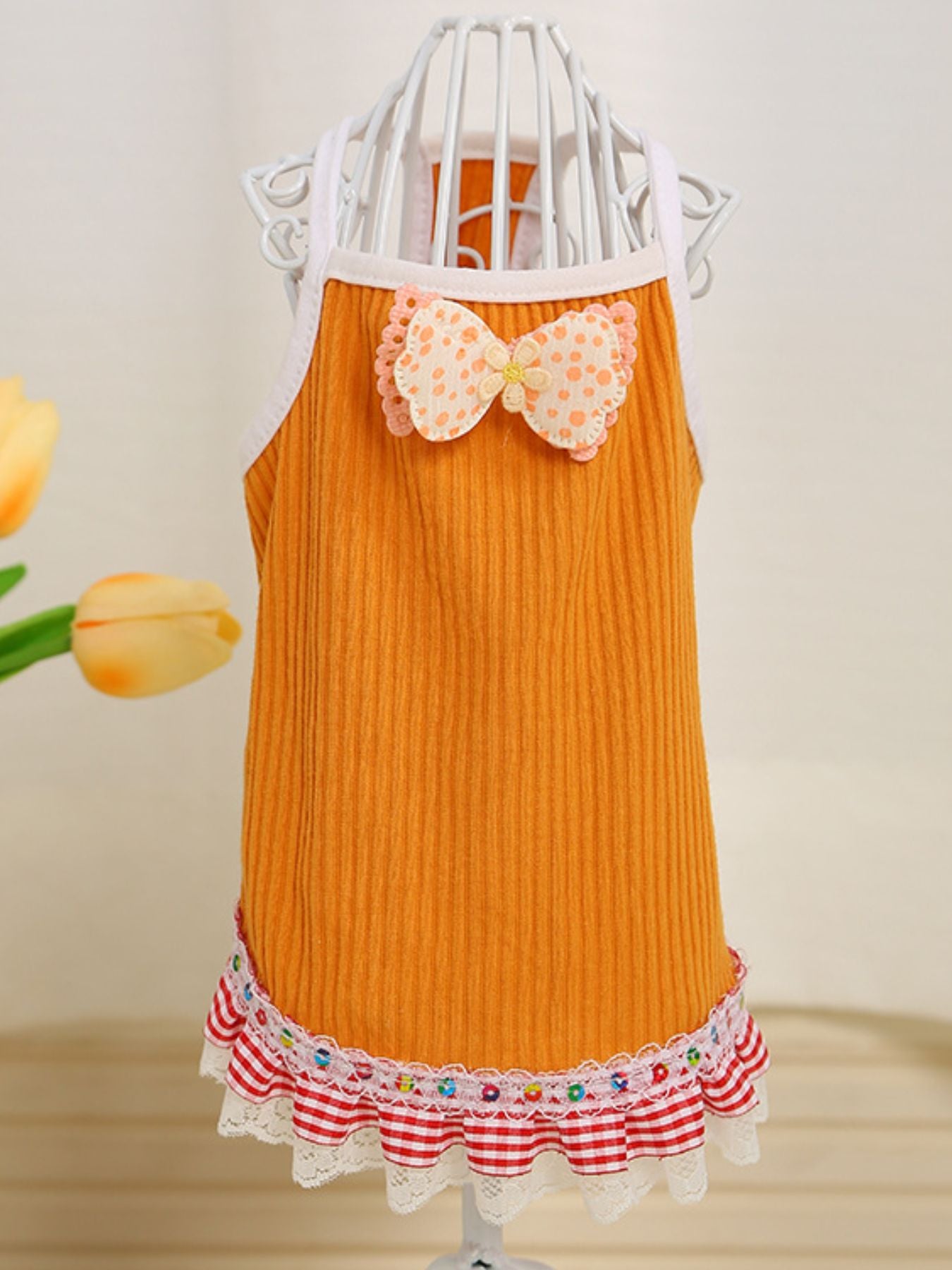 Orange bowknot ruffled hem pet top for dogs, XS size, trendy dog clothing by Trendsi featuring a stylish design.