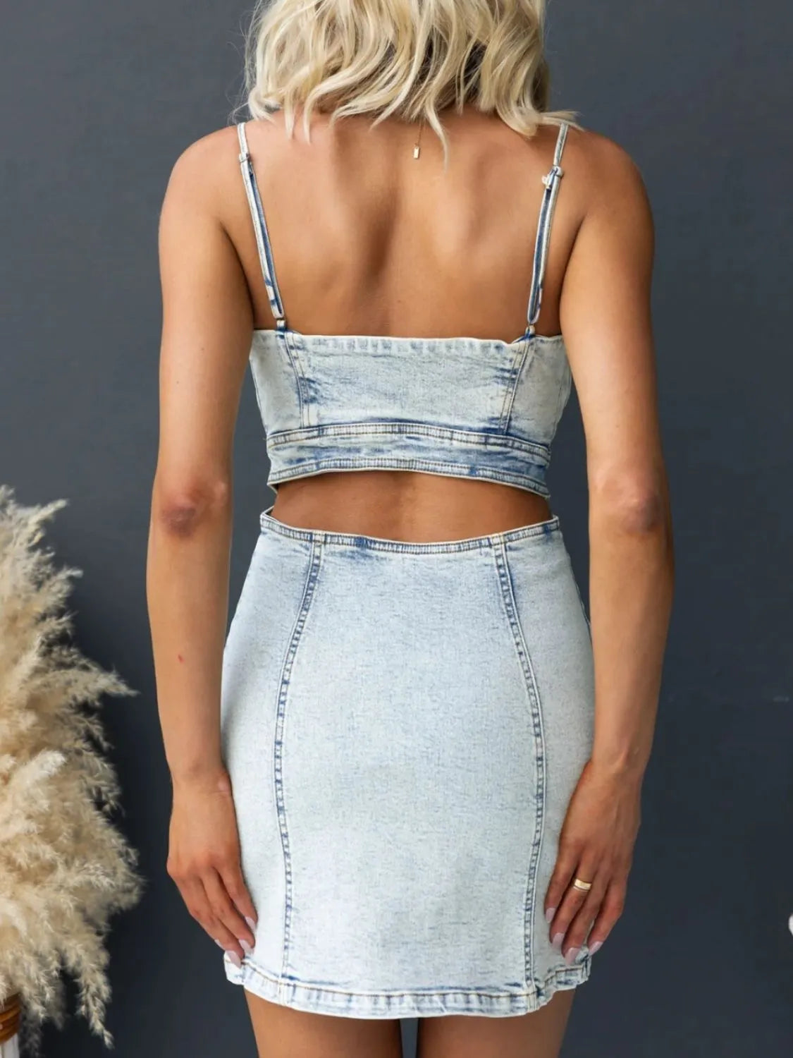 Light wash denim cami dress with cutout back and sweetheart neckline, trendy fashion piece by Trendsi.