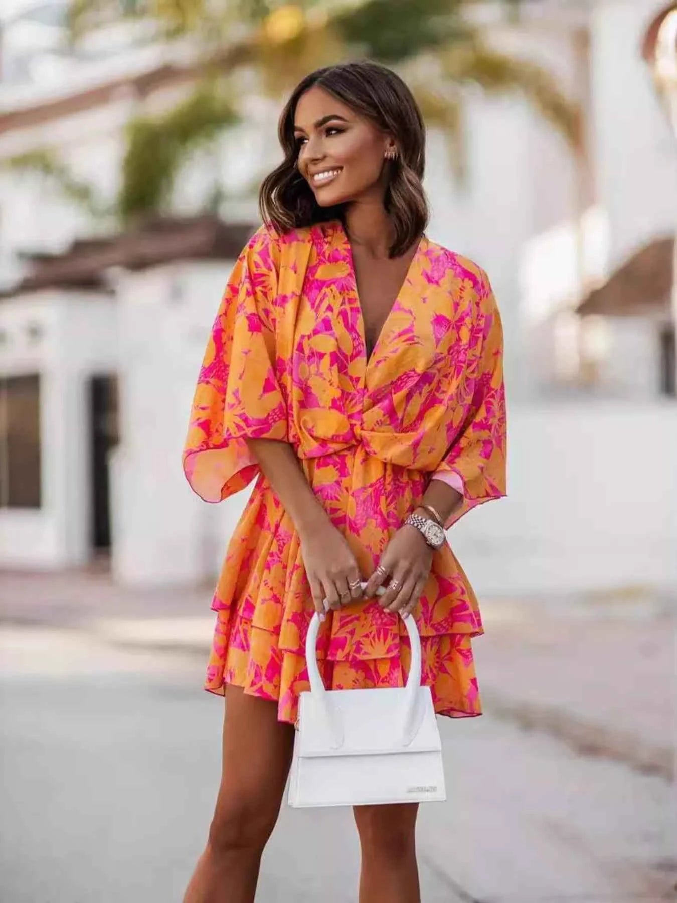 Orange chic layered printed surplice mini dress, trendy dress by Trendsi with stylish design and effortless style.