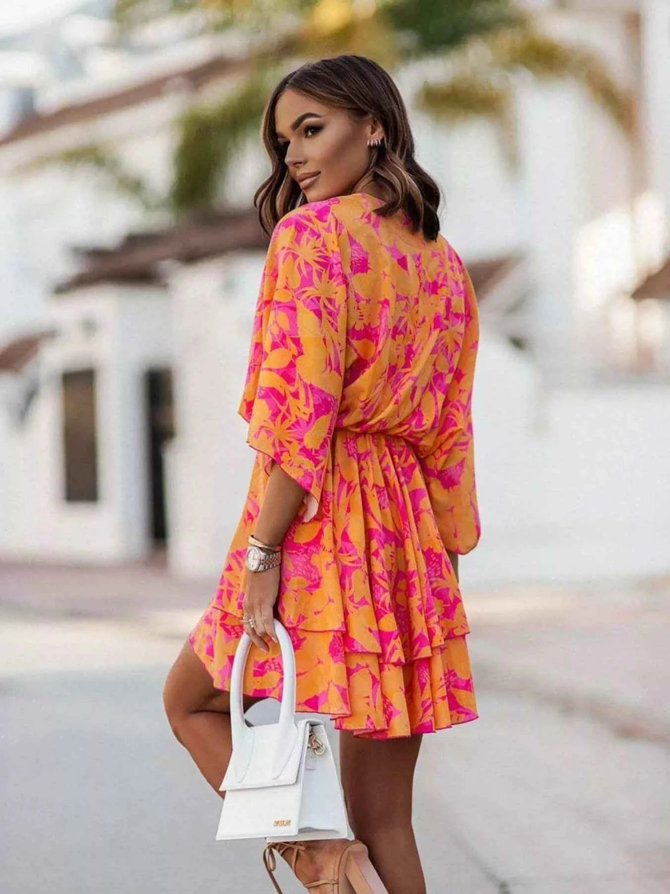 Orange Trendsi chic layered printed surplice mini dress, stylish and effortless for casual or semi-formal occasions.