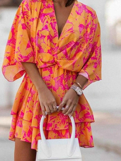 Orange Chic Layered Printed Surplice Mini Dress from Trendsi, stylish and effortless for casual or semi-formal occasions.