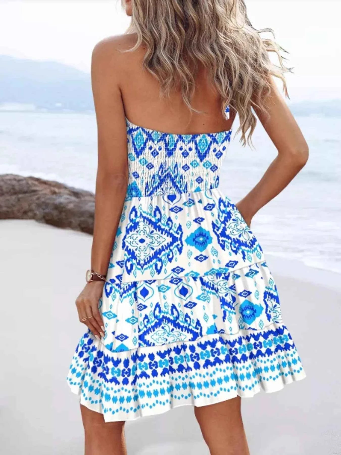 Sky-blue halter neck mini dress with smocked waist, stylish dress by Trendsi featuring a flattering silhouette for any occasion.
