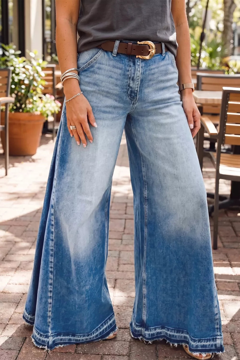 Dusty blue flare leg jeans with side seam gathering from Trendsi, showing a close-up of the stylish design and fabric texture.