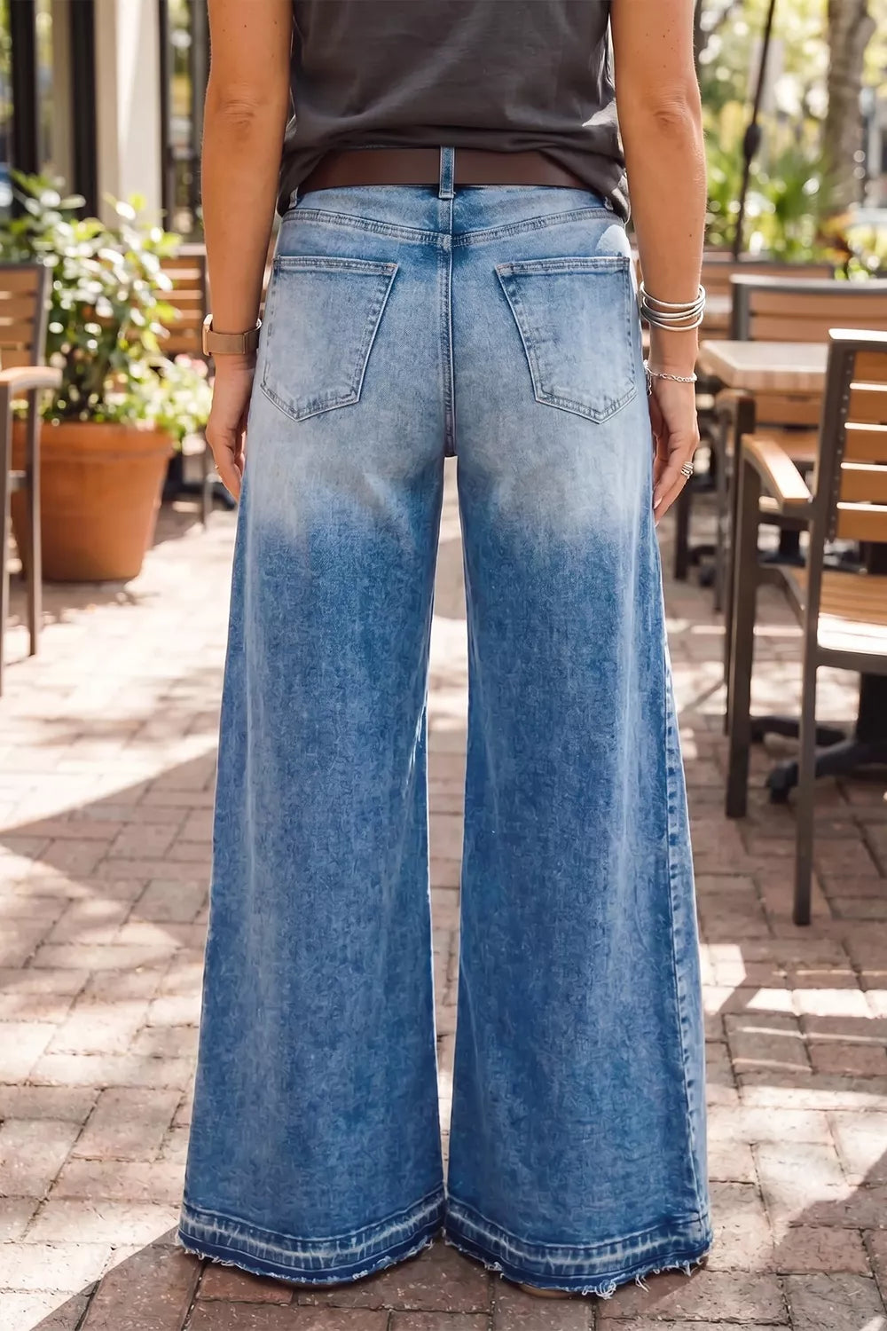 Dusty blue flare leg jeans with side seam gathering from Trendsi, showcasing a high-waisted fit and stylish silhouette.