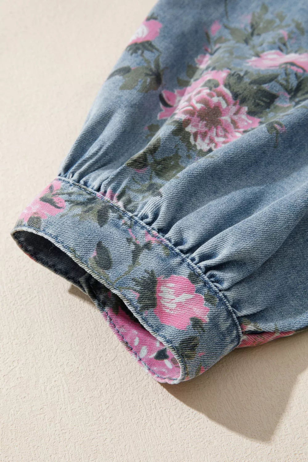 Dusty blue floral print button-up denim shirt by Trendsi, featuring a classic collar and long sleeves.