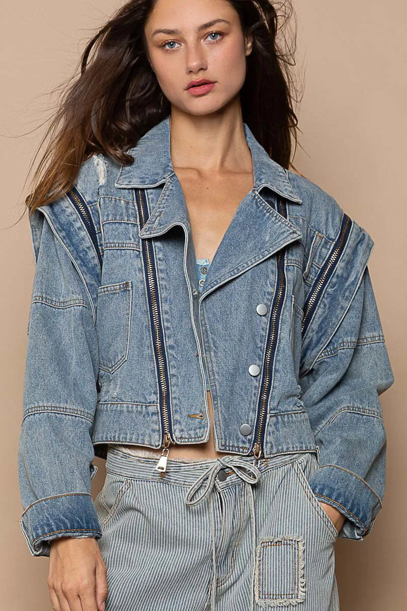 Dusty blue POL cropped denim jacket by Trendsi featuring functional zipper details and classic denim styling.