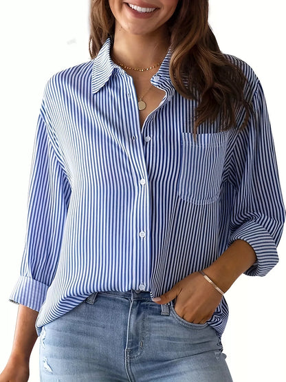 Striped button-down relaxed fit shirt from Trendsi, featuring vertical blue and white stripes and a casual collar.
