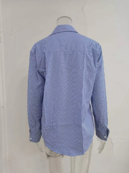 Relaxed fit striped button-down shirt by Trendsi, featuring blue and white vertical stripes and a casual, comfortable style.