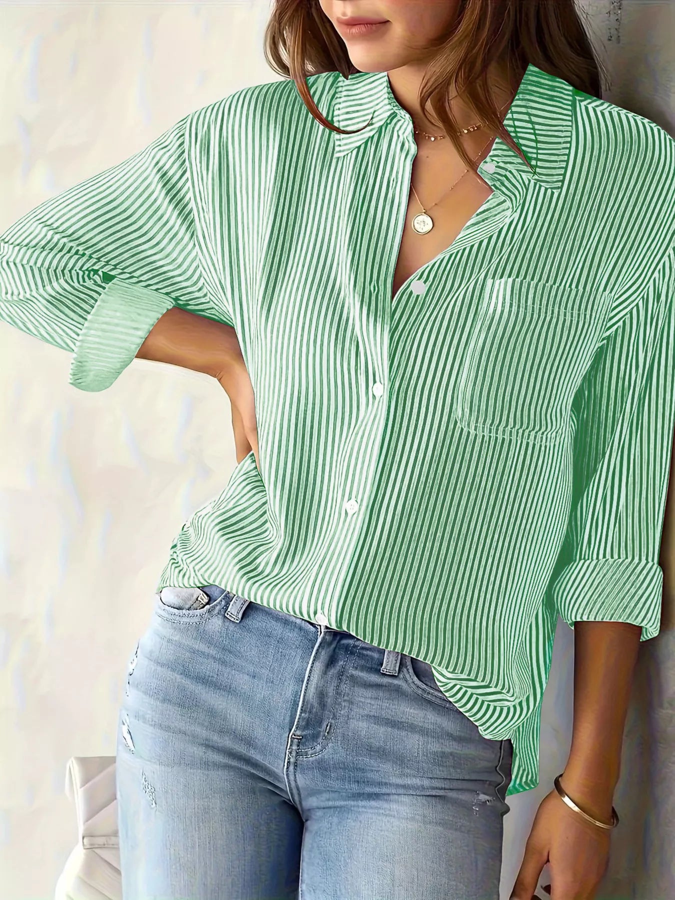 Relaxed fit striped button-down shirt by Trendsi, featuring a casual style with vertical stripes and classic collar.