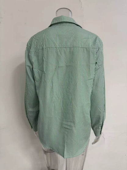 Relaxed fit striped button-down shirt from Trendsi, featuring a casual design with vertical blue and white stripes.