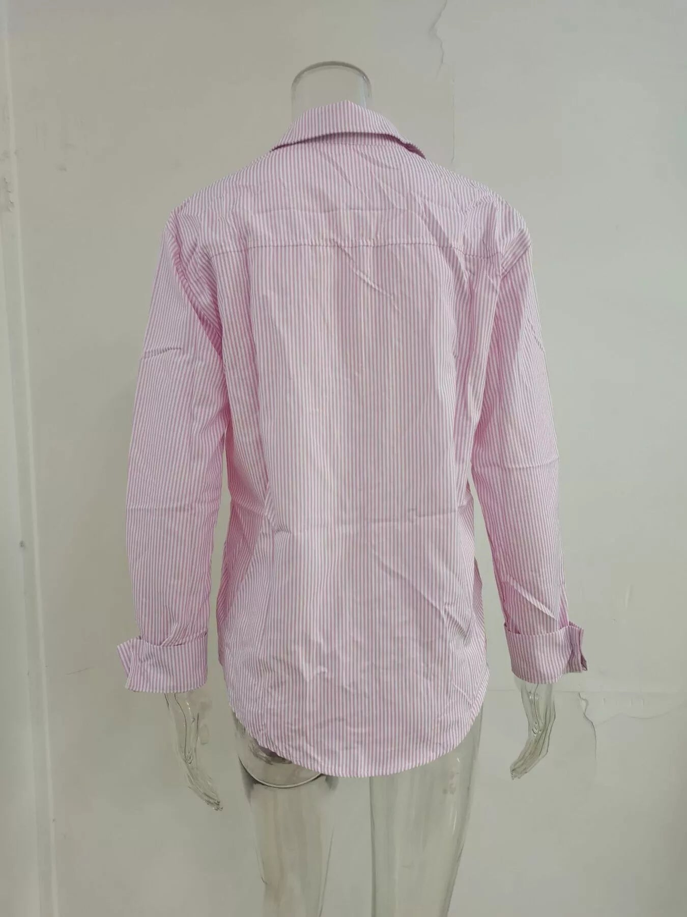 Striped button-down relaxed fit shirt from Trendsi, showing a casual stylish design with blue and white stripes.