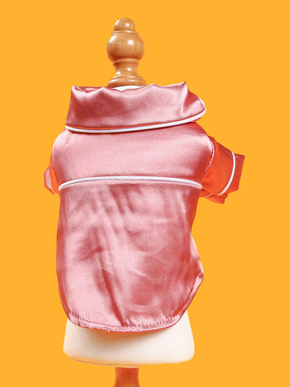 Dusty pink satin pet pajamas with contrast piping, featuring comfortable fit and stylish design for pets.