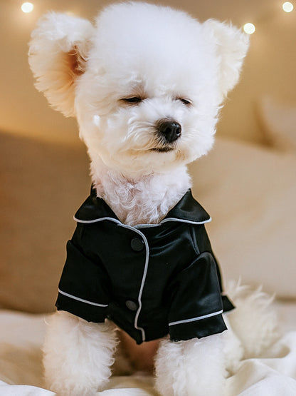 Dusty pink satin pet pajamas with contrast piping, featuring a comfortable fit for small pets.
