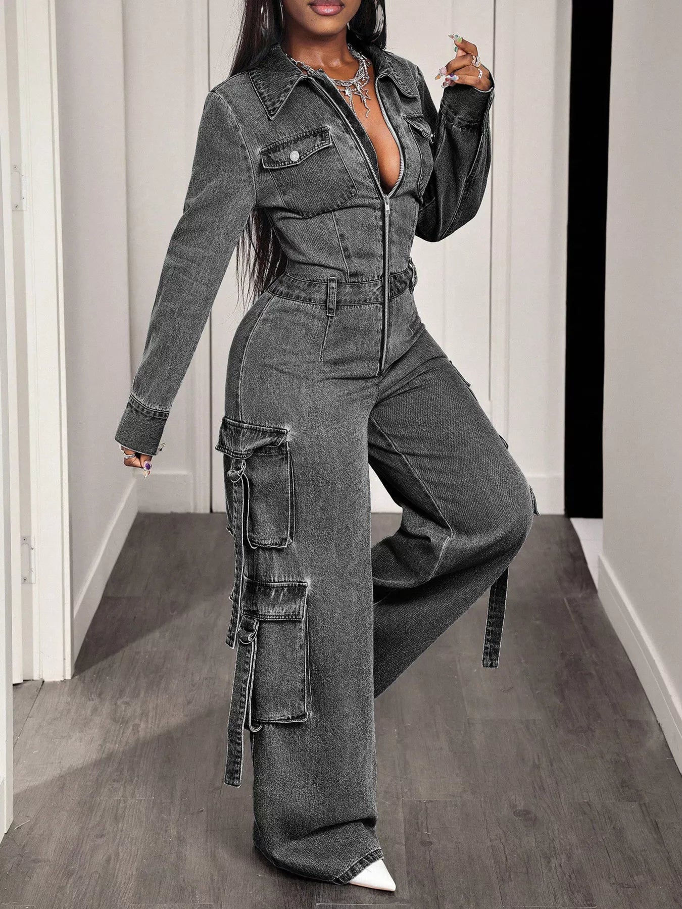 Denim jumpsuit by Trendsi featuring a zip front, wide-leg cargo design, with functional pockets and a casual, stylish fit.