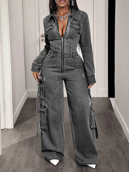 Denim jumpsuit with zip front, wide-leg cargo pants, and adjustable straps, styled in trendy blue denim fabric.