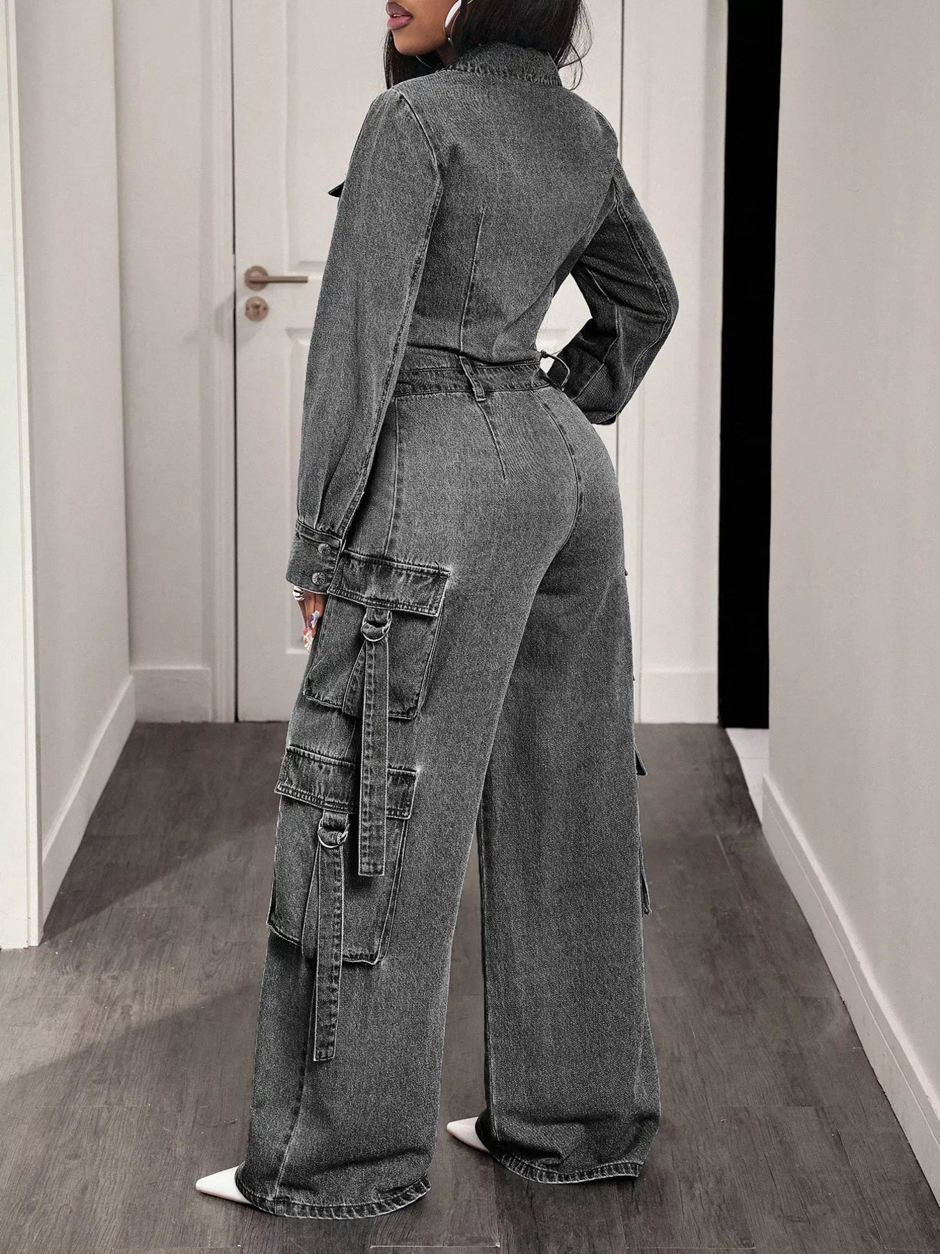 Denim jumpsuit by Trendsi featuring a zip front, wide-leg cargo style, with multiple pockets and a casual, stylish fit.