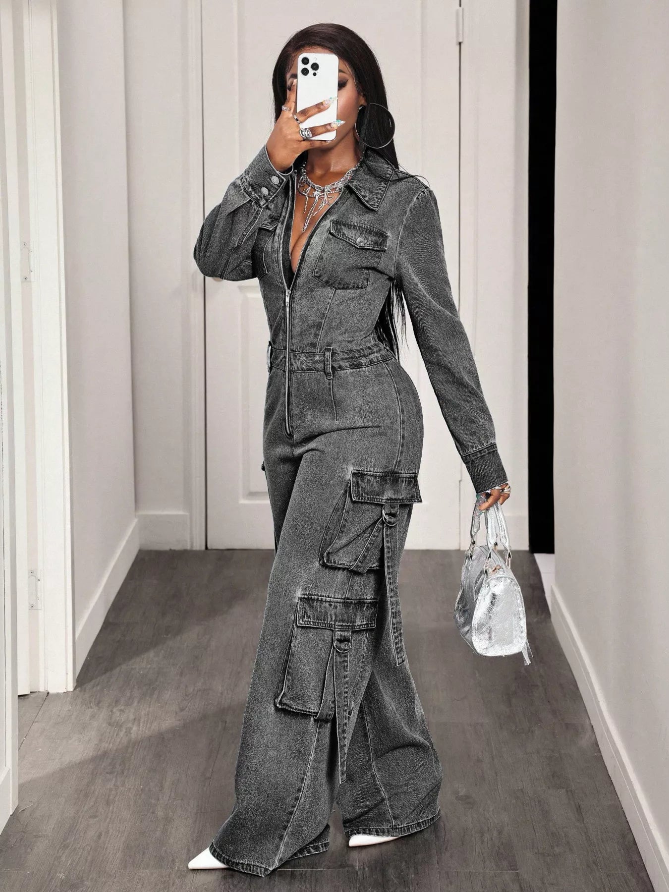 Denim jumpsuit with zip front and wide-leg cargo style, featuring multiple pockets and adjustable straps, by Trendsi.