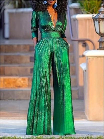 Green deep V-neck wide-leg jumpsuit by Trendsi, featuring a stylish fit and flowy fabric, perfect for casual or dressy occasions.