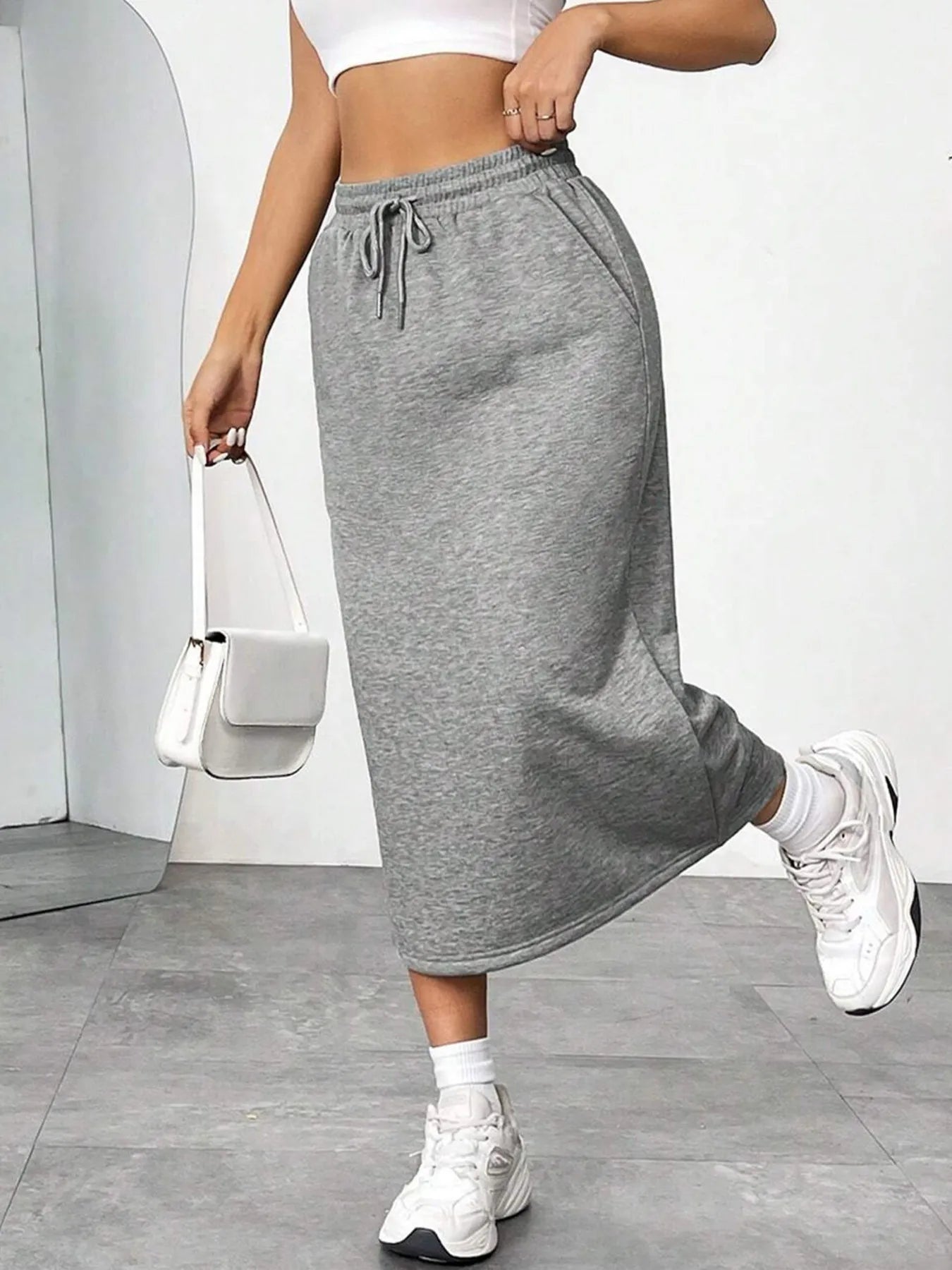 Trendsi slit drawstring midi skirt in lightweight fabric, featuring a high waist and side slit for a stylish, casual look.