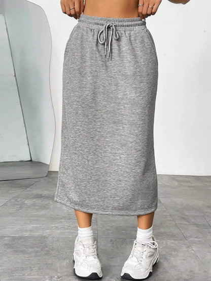 Trendsi slit drawstring midi skirt in lightweight fabric with a high slit and adjustable waist tie, styled for a casual look