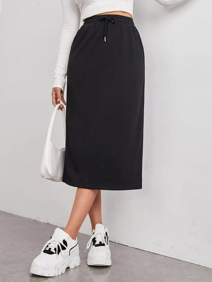 Trendsi slit drawstring midi skirt in lightweight fabric with side slit and elastic waist, styled with a casual top.