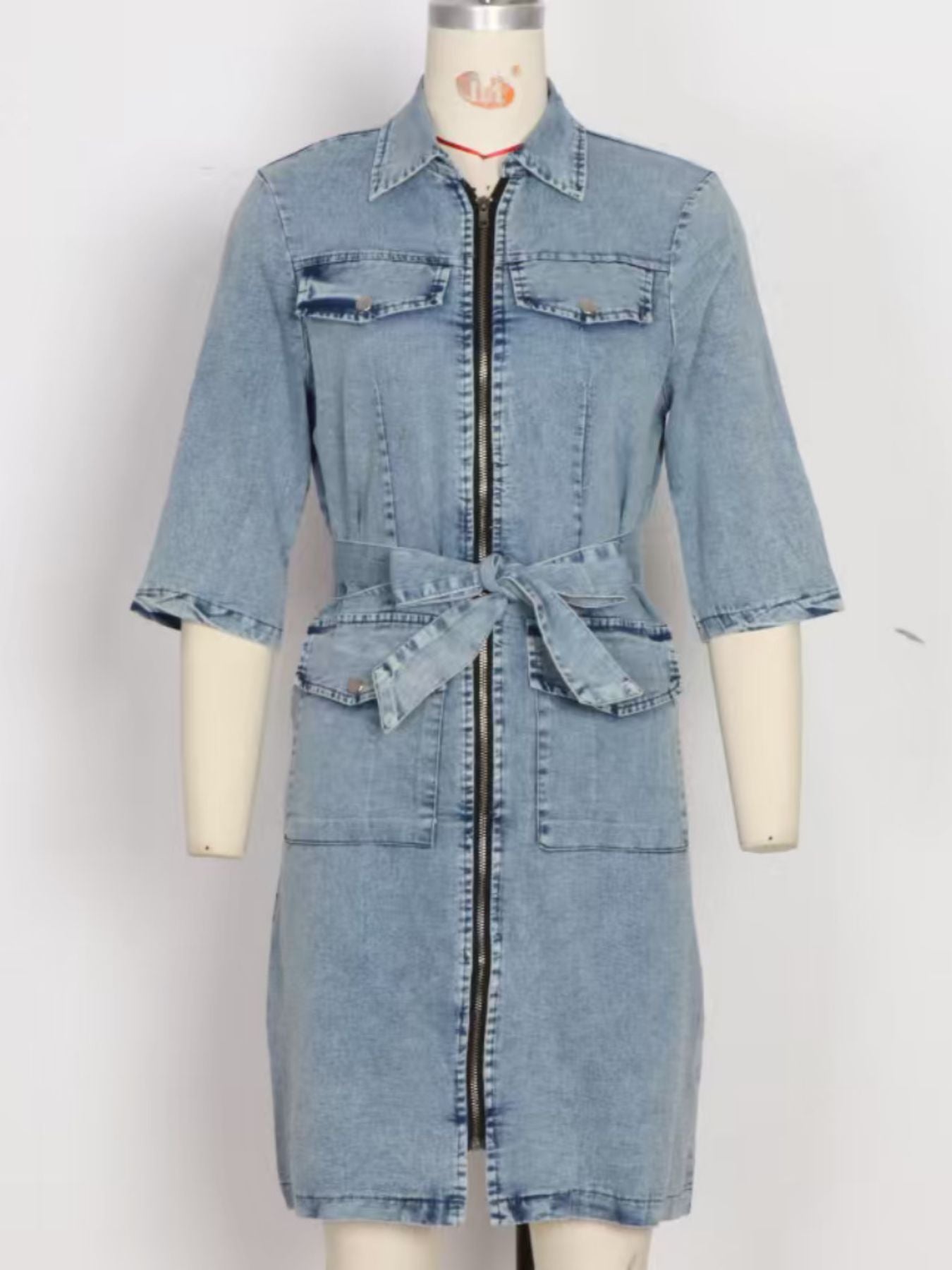 Grey zipper front short sleeve denim dress from Trendsi, featuring a fitted silhouette and classic denim fabric.