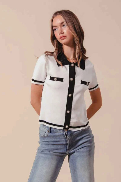 Ivory and black SO ME button-down knitted sweater shirt top by Trendsi, featuring a cozy, stylish button-up design.
