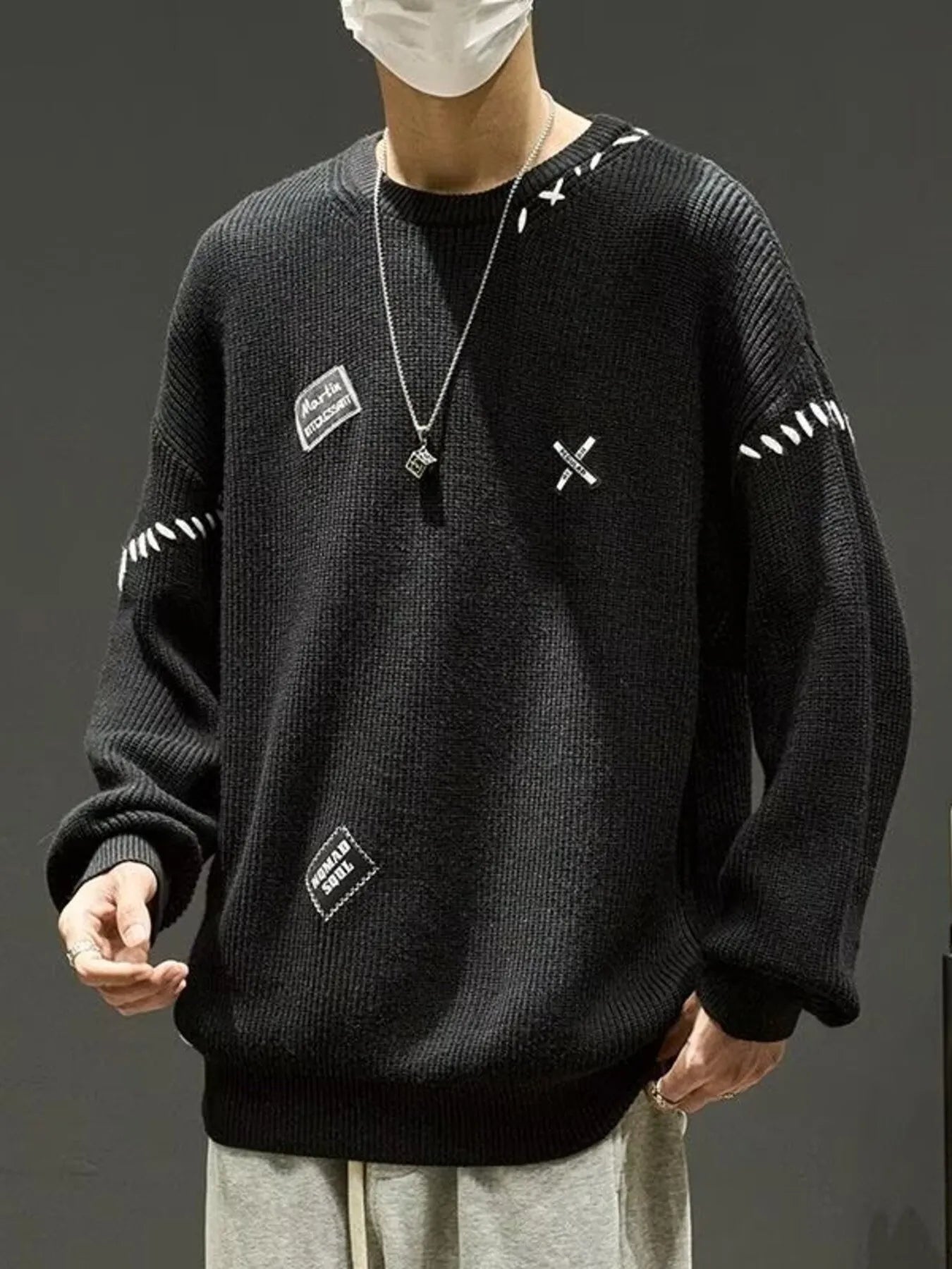Men's ivory dropped shoulder long sleeve sweater by Trendsi, featuring a relaxed fit and soft knit fabric.