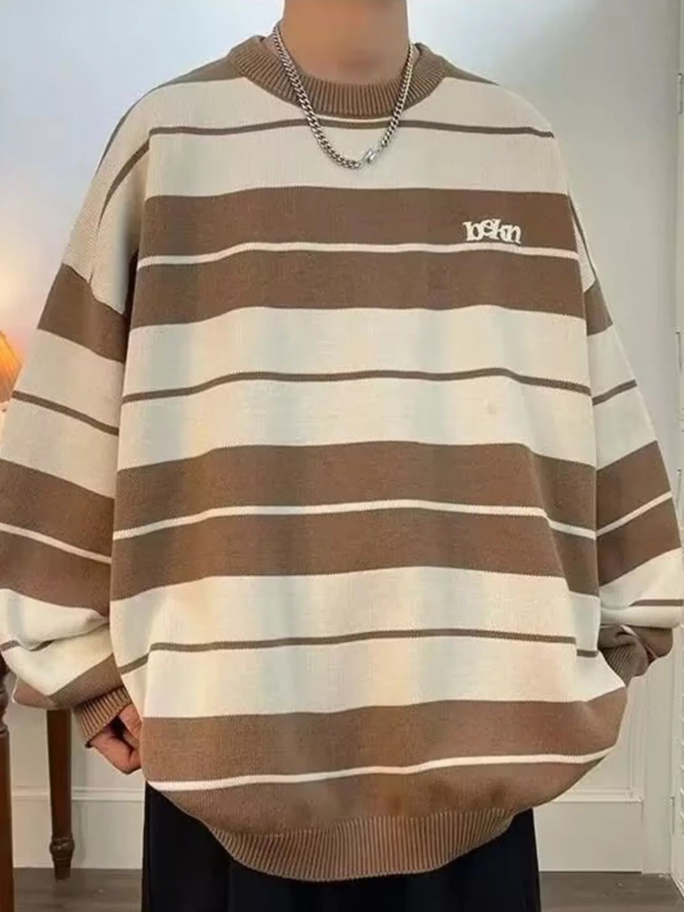 Men's ivory dropped shoulder long sleeve sweater by Trendsi, featuring a relaxed fit and ribbed cuffs.