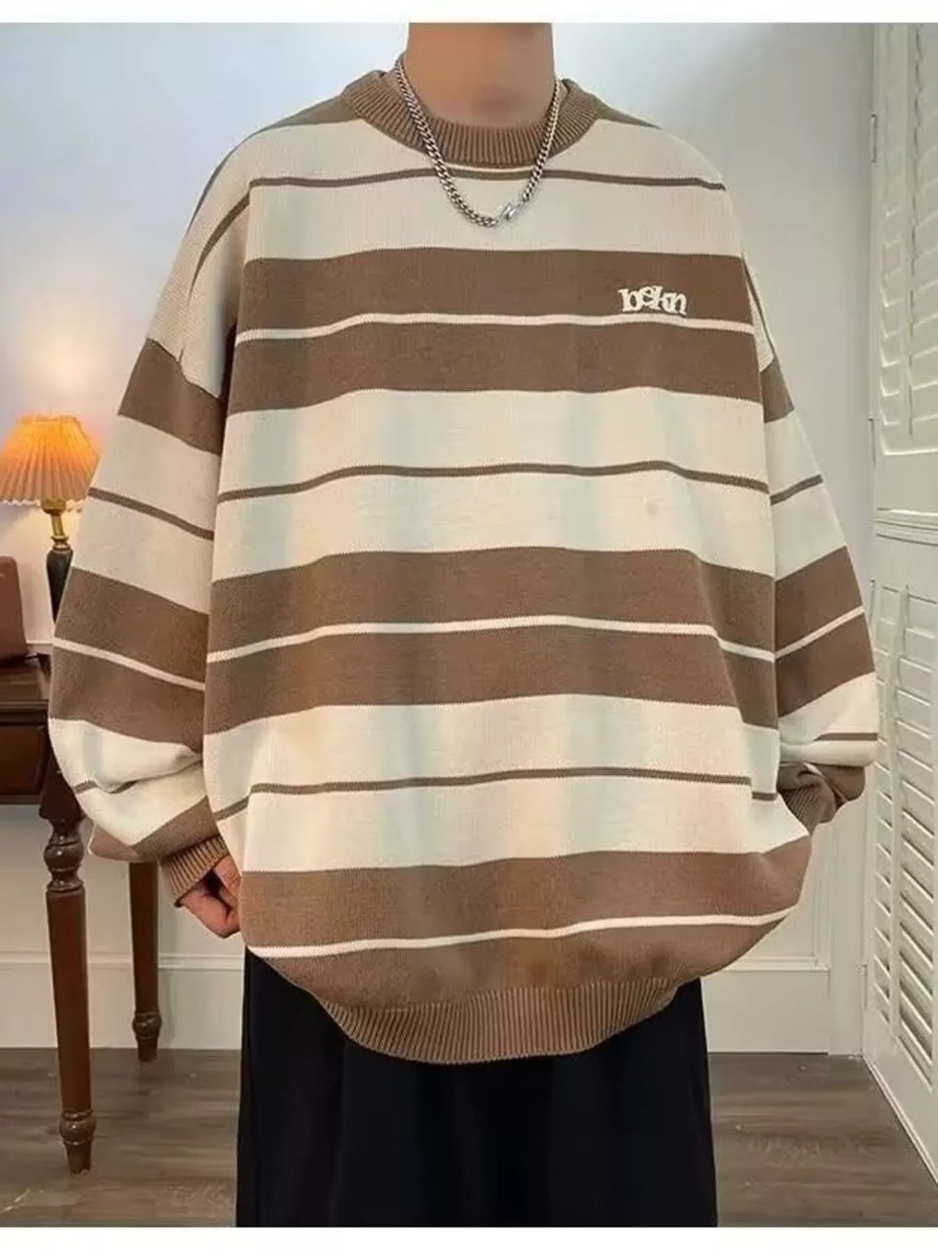Men's ivory dropped shoulder long sleeve sweater by Trendsi, featuring a relaxed fit and soft knit fabric.