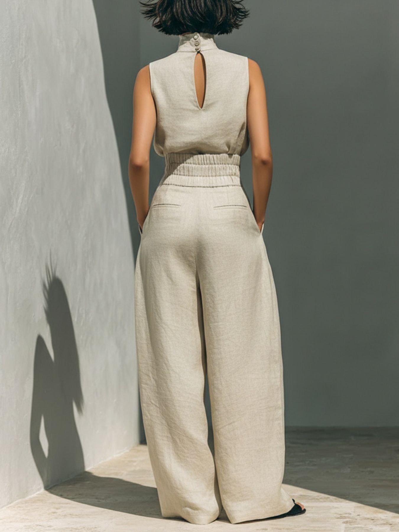 Sleeveless turtleneck top and matching pants set by Trendsi, featuring a stylish, coordinated fashion look.