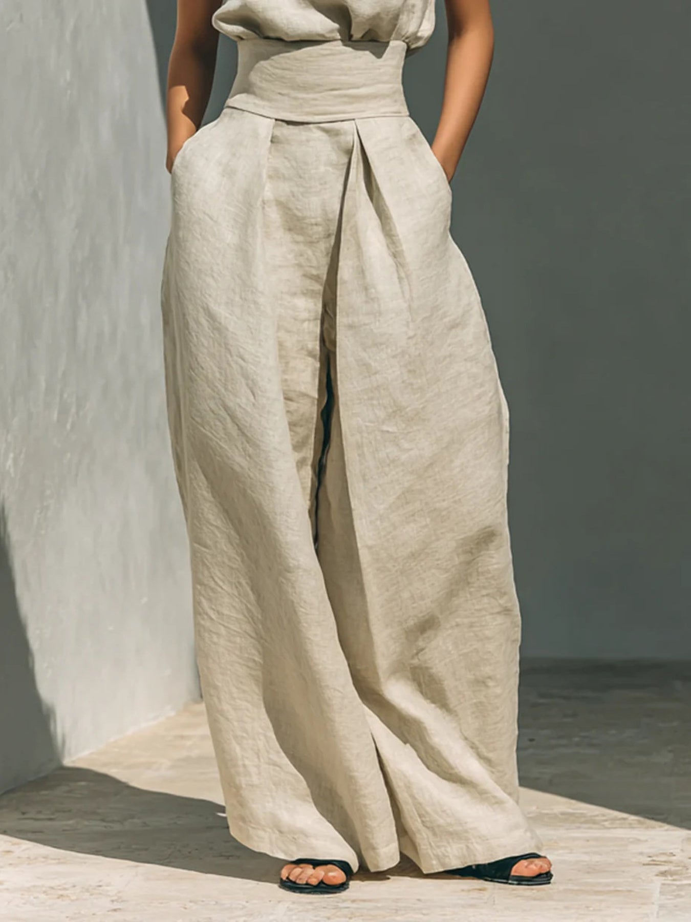 Sleeveless turtleneck top and matching pants set from Trendsi, stylish and comfortable for casual wear.