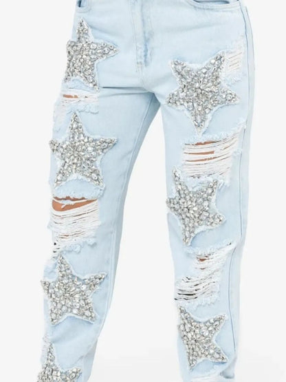 Blue distressed star wash boyfriend jeans from Trendsi, featuring a relaxed fit and casual style.