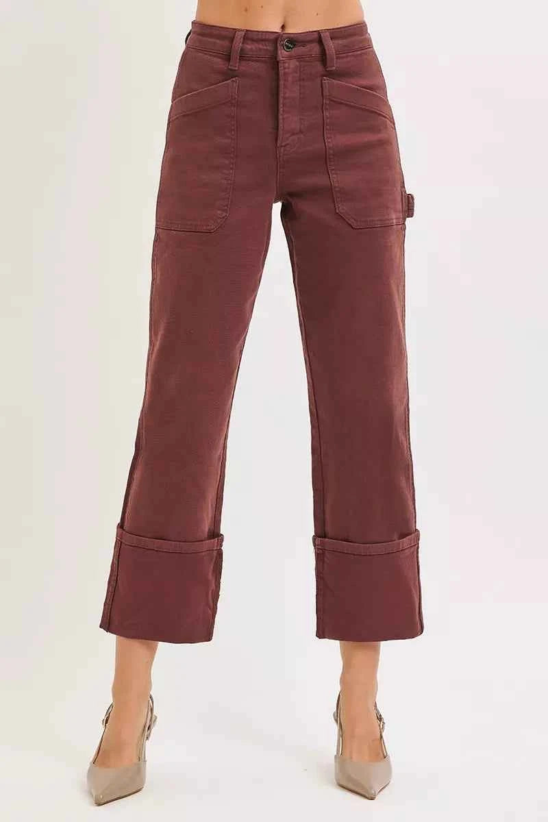Plus size RISEN high rise wide straight cuffed patch jeans by Trendsi, showing the full length with cuffed hems and distressed patches.