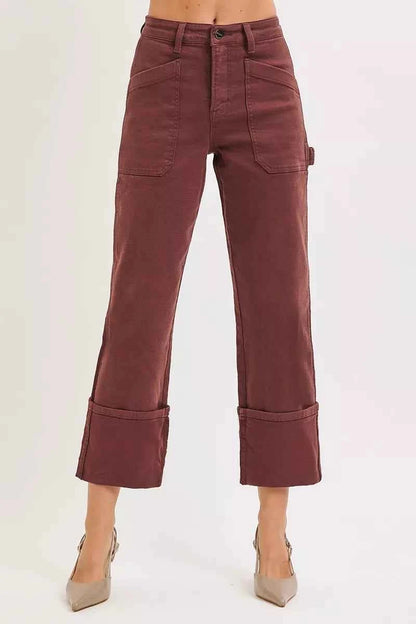 Plus size RISEN high rise wide straight cuffed patch jeans by Trendsi, showing the full length with cuffed hems and distressed patches.