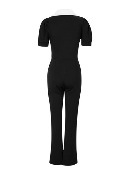 Black contrast button-down wide-leg jumpsuit by Trendsi featuring a relaxed fit and stylish design.