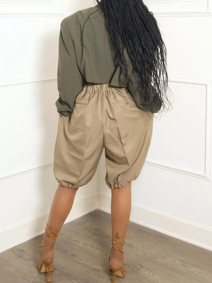 Khaki high waist shorts with pleated details from Trendsi, featuring a stylish and comfortable design.