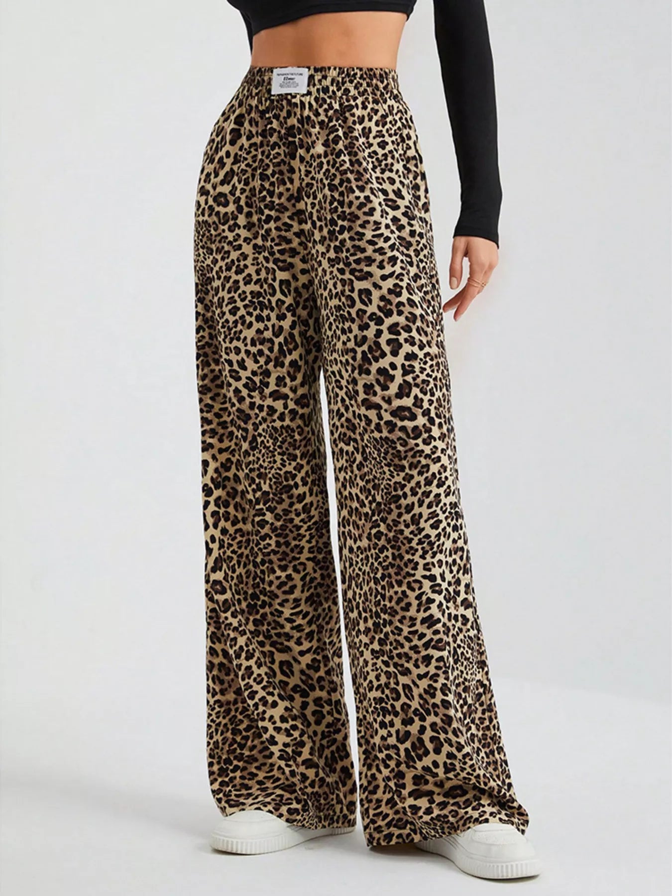 Plus size leopard print wide leg pants by Trendsi featuring a bold animal pattern and relaxed fit, full-length design.