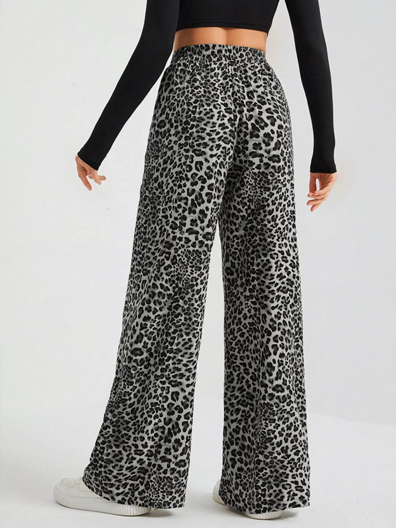 Plus size leopard print wide leg pants by Trendsi, showcasing the full length and bold animal print design.
