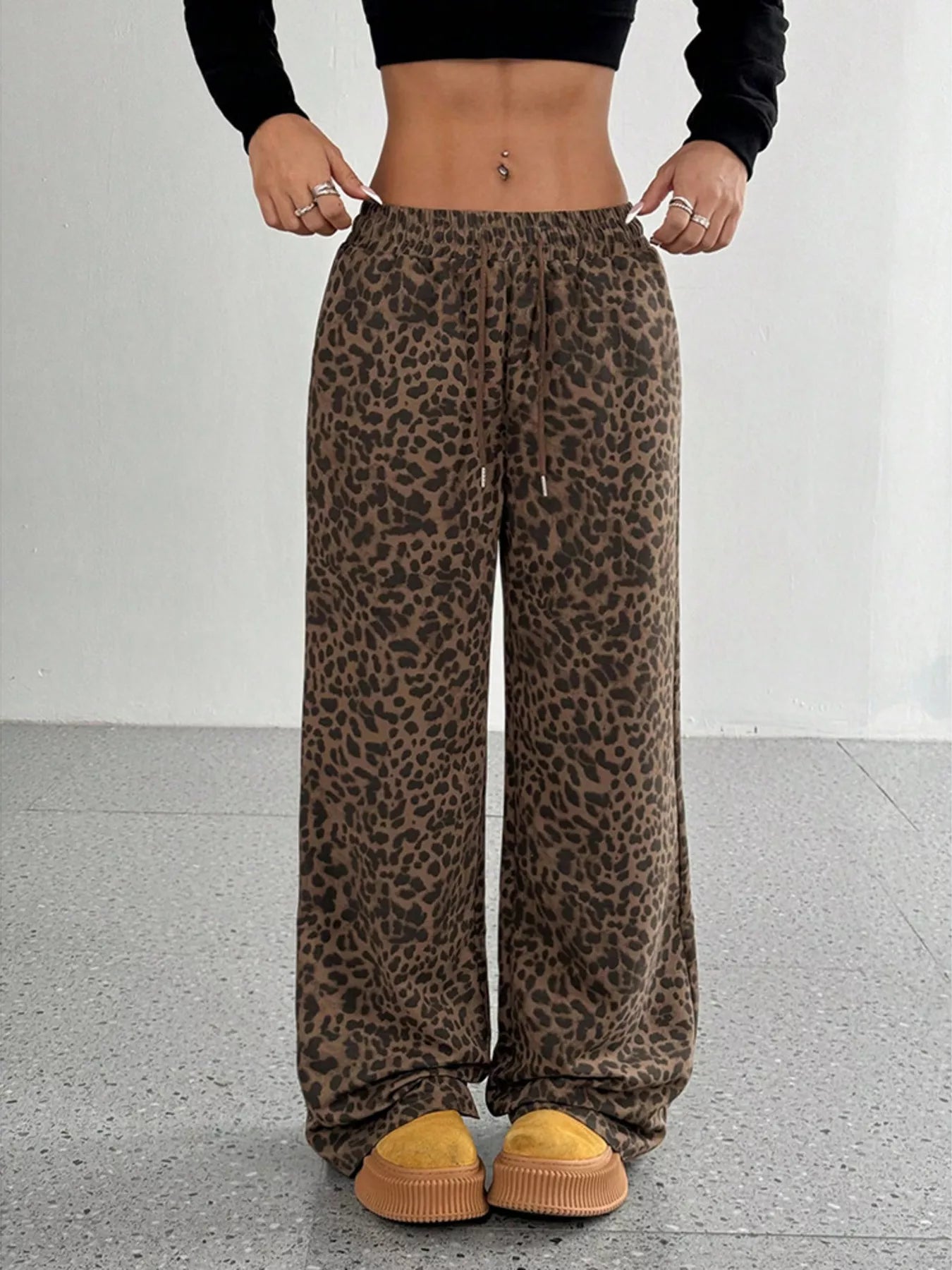 Plus size leopard print wide leg pants by Trendsi, featuring a full-length design and bold animal pattern.